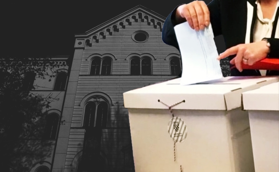 kutija s glasačkim listićima, u pozadini zgrada sveučilišta u zagrebu